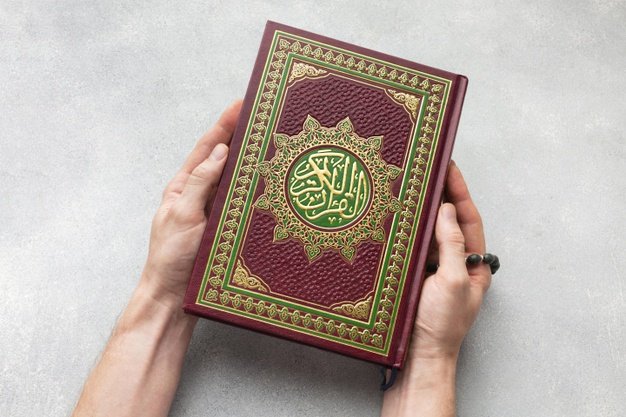 male-holding-quran-book-in-hands